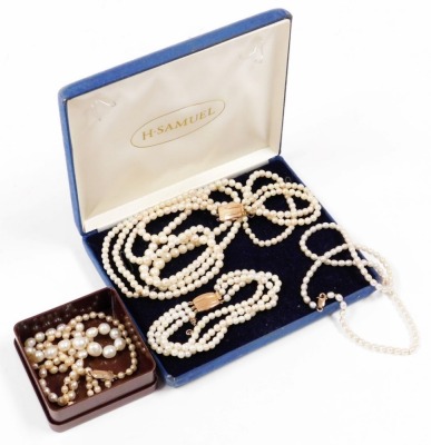 A group of cultured pearl jewellery, a Ciro two piece set, to include three strand bracelet, with a 9ct gold clasp and safety chain, 19cm long, the matching necklace (AF), 42cm long, together with two single strand necklaces, one of graduated form, 60cm l