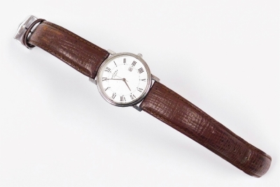 A Rotary gents wristwatch, with circular watch head, with silvered finishing with Roman numerals and date aperture, in a stainless steel case, on a brown leather strap, numbered GS77834/21, the dial 3cm wide, boxed. - 2