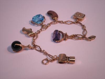 A fancy link charm bracelet with 7 attached charms