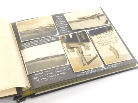 A 1950s photograph album, army, Middle Eastern scenes, war and other related, to include various photographs of aeroplanes, buses and figures, Hermes at Stansted Airport, Kano Nigeria West Africa to include buildings, native dwellings, tour guide and taxi