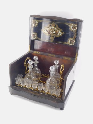 A 19thC French black lacquered decanter box, of serpentine rectangular form, inlaid with metal work and mother of pearl to the initialled lid, hinging to reveal a part fitted interior set with decanter bottles and glasses, on a serpentine base terminating - 2