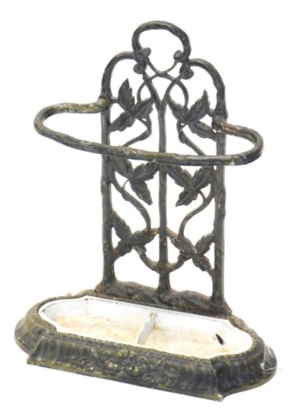 A Victorian cast iron and green enamel two division umbrella stand, decorated with leaves, etc., 59cm high. (AF)