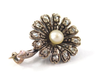 A diamond and pearl set brooch, with petal set rose cut diamonds, and central cultured pearl in a white gold overall finish but generally made up of gold and silver, tests as 15ct, 3.2g, 2cm wide.