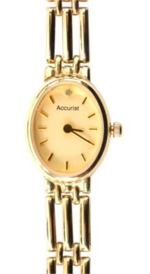 A 9ct gold Accurist ladies wristwatch, the oval dial set with diamond set twelve point, on a three bar bracelet, 16.4g all in, boxed.