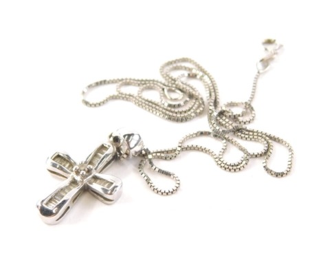 A 9ct white gold diamond crucifix pendant and chain, the crucifix with central round brilliant cut diamond and baguette cut outer stones 2.5cm high on a 9ct white gold box link chain, 44cm long ,3.7g all in