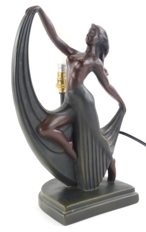 An Art Deco style table lamp, in the form of a semi clad dancing lady, in flowing skirt on D shaped base, with electrical fitting, unsigned, 37cm high.