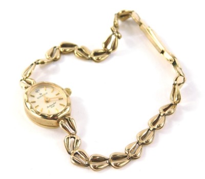 A Sovereign 9ct gold ladies wristwatch, with small circular watch head and tiny diamond set 12 o'clock point, on a pierced design 9ct gold bracelet, 20cm long overall, 9.7g all in.