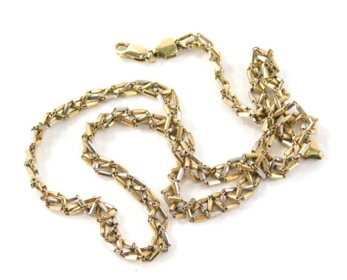 A 9ct gold bi-colour multi link chain, with raised twist links stamped Italy 375, 55.5cm long, 17.7g all in.