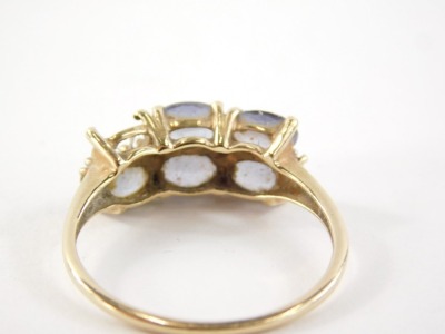 A 9ct gold amethyst dress ring, set with six oval amethysts (1 missing), in claw setting with tiny cz set shoulders, the band fully hallmarked 375 and also stamped 10k, ring size U, 2.5g all in. - 2