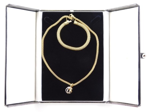 A Fope necklace and bracelet set, comprising for The Millennium 18ct gold woven bracelet, 20cm long, and matching necklace with Millennium orb ball, set with tiny diamonds, the chain 44cm long, the pendant 3cm high, 57.1g all in, in a H L Brown of Sheffie