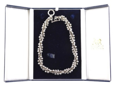 A modern silver neck chain, of twist and orb form, with outer beaded detailing with loop and bar clasp, 46cm long, 170.6g all in, in a Braybrook and Britten box.