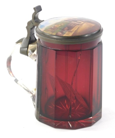 A 19thC ruby and clear glass Bohemian tankard, the lid inset with a continental porcelain plaque with hinged lid, 16cm high. Provenance; Worksop Manor, home of the Howard family Dukes of Norfolk,