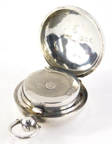 A Victorian silver sovereign case, of circular form, with spring loaded engine turned centre and plain hook top, Birmingham 1898, ½oz.