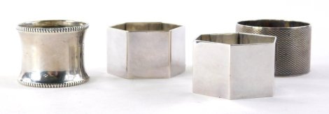 Four various silver napkin rings, to include a George VI Sheffield example, of circular engine turned form, Birmingham 1944, and three others, 4½oz. (4)