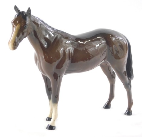 A 20thC Royal Doulton figure, of a bay horse, standing, brown colourway, marked beneath, 20cm high.