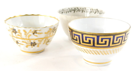 A late 19thC Spode tea bowl, another with blue crest marked beneath probably Caughley and a further tea bowl decorated with flowers, 8cm diameter. (3)