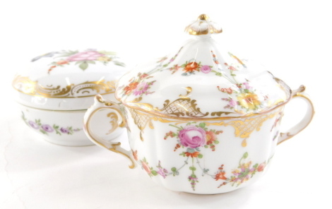 A 20thC Dresden porcelain lidded loving cup, profusely decorated with garlands of flowers with gilt highlights marked beneath, 10cm high and a Meissen style powder box of circular form with removable lid, hand painted with flowers with gilt highlights, do