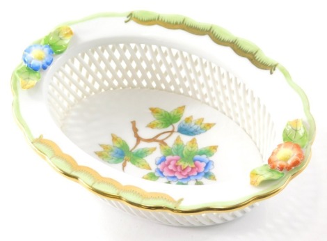 A Herend porcelain pin dish, of floral form, handpainted with flowers with a lattice work border, marked beneath, 15cm wide.