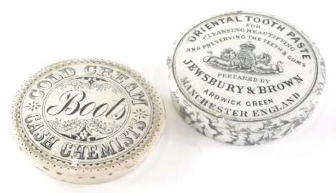 A Jewsbury and Brown oriental paste black and white transfer printed pot lid, 8cm diameter, and another Boots Cold cream, Cash Chemists. (2)