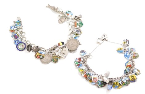 Two silver crested charm bracelets, with various enamel set crests, some stamped 800 some stamped 925, one on curb link, 20cm long, the other with curb link safety chain and heart shaped padlock, 12cm wide, 107.4g all in.