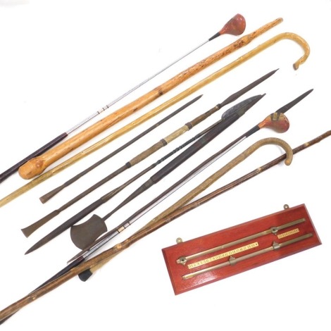 Various walking sticks, tribal sticks, shepherds crook, crook walking stick, knobkerrie style stick, 122cm high, snooker scoreboard, Aristocrat golf driver, etc. (a quantity)