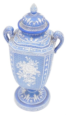 A 20thC Noritake pate sur pate style vase, in blue and white floral decoration, the base decorated with Greek key pattern and bell flowers, printed marks beneath, 34cm high.