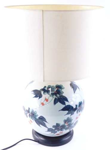 A 20thC oriental style table lamp, with modern shade and electrical fitting, 60cm high.