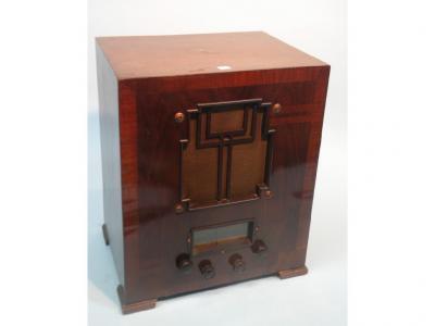 A Marconi radio in a walnut and crossbanded case with bakelite fittings