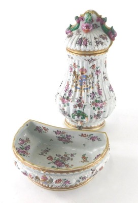 A late 19thC Samson Paris porcelain wall cistern, in famille rose palette, with a shaped serpent and scroll back, the centre decorated with a coat of arms and further flowers, with front tap and removable lid, faux oriental marks beneath, 32cm high, with