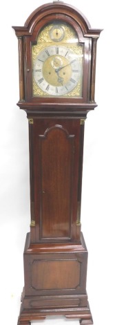 A late 19thC mahogany longcase clock, the arched case surmounted by an orb and eagle finial, with arched dial with raised spandrels, 28cm diameter chapter ring with Roman numeric and Arabic dial with subsidiary second hand and chime and silent feature, wi