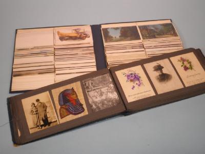 Two albums of vintage topographical and other postcards