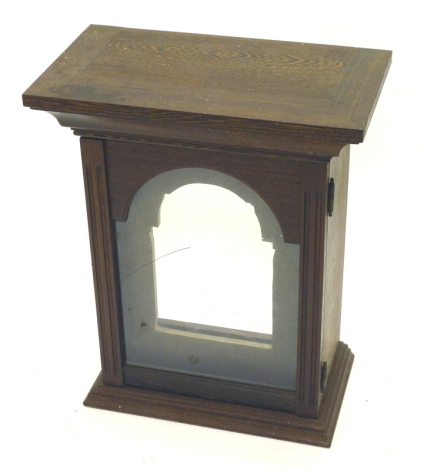 An oak cased longcase clock hood, of rectangular form with plain glass front.