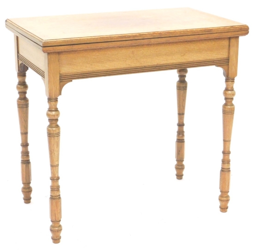 Oak Card Table A late 19thC oak card table, the rectangular top with a moulded edge ...