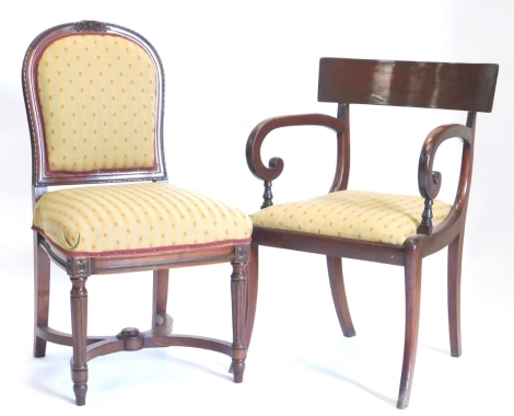 A mid 19thC mahogany carver chair, with drop in seat in Regency stripe style material on saber legs, 88cm high, and a further heavily carved French open dining chair, with overstuffed back and seat. (2)