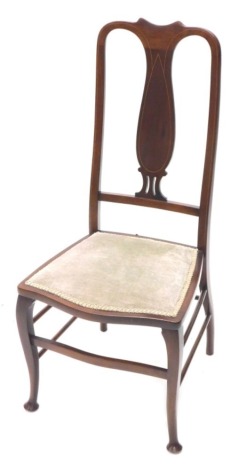 An Edwardian mahogany and boxwood strung bedroom chair, with a padded seat on cabriole legs.