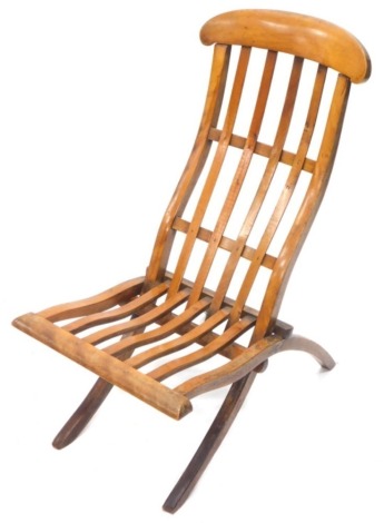 A Victorian folding mahogany campaign chair, with a slatted back and seat.