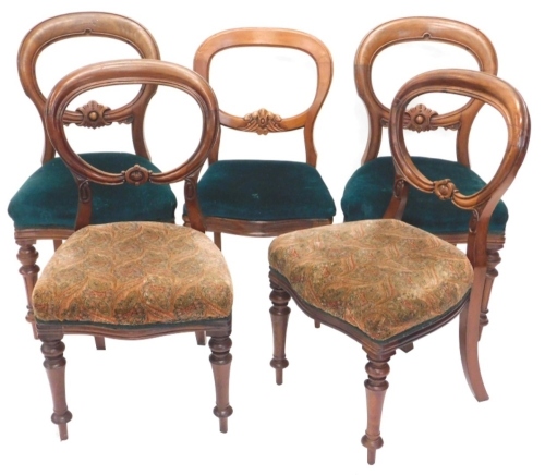 A harlequin set of five Victorian mahogany balloon back chairs, each with a padded seat on turned legs.