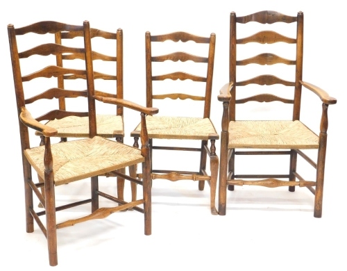 An associated set of four 19thC ash and elm ladder back dining chairs, each with rush seat on turned legs, 112cm high, two with arms, etc.