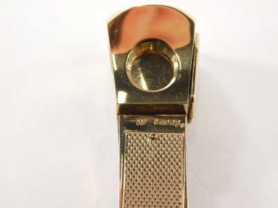 A 9ct gold cigar cutter, with ring top, partially engine turned, 6cm high, 31g, in an associated box. - 6