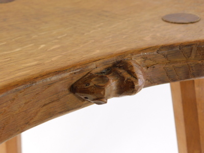 A 1970s Robert Thompson of Kilburn Mouseman oak cow stool, with saddle seat carved with mouse to the side on three legs, 46cm high. - 6