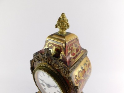 A French late 19thC Boulle mantel clock, the circular dial enamel dial signed Bright a Paris, and bearing Roman numerals, with Japy eight day movement striking on a bell, the case of balloon form, with pendulum and key, 31cm high, 16cm wide, 9cm deep. - 15
