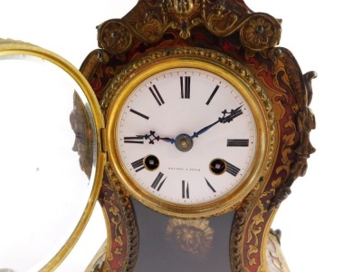 A French late 19thC Boulle mantel clock, the circular dial enamel dial signed Bright a Paris, and bearing Roman numerals, with Japy eight day movement striking on a bell, the case of balloon form, with pendulum and key, 31cm high, 16cm wide, 9cm deep. - 17