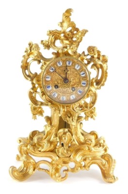 A late 19thC French ormolu mantel clock, circular enamel and gilt dial bearing blue Roman numerals, retailer Grohe Wigmore Street, eight day movement by Raingo Freres, Paris, with bell strike, the case of rococo scroll des, with pendulum and key, 33cm hig - 13