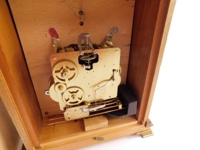 A mahogany cased mantel clock, with arched brass dial, silvered chapter ring with Roman numerals and brass spandrels formed as Amorini, the circular maker's plaque marked D J Hallwood Ely, with a caddy top and brass four point finials, on brass ogee brack - 11