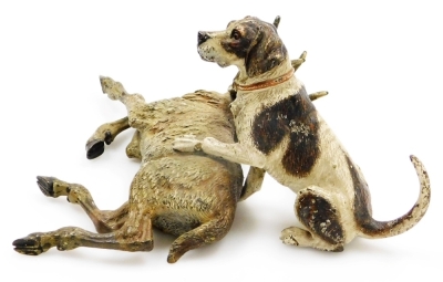 A late 19th/early 20thC cold painted bronze animalier group, in the manner of Bergman, modelled in the form of a hound with paw raised over a recumbent stag, bears possible signature, 10cm high, 18cm wide. - 7