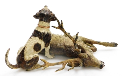 A late 19th/early 20thC cold painted bronze animalier group, in the manner of Bergman, modelled in the form of a hound with paw raised over a recumbent stag, bears possible signature, 10cm high, 18cm wide. - 8