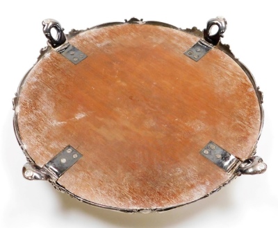 A Victorian silver plated wedding cake stand, with a mirrored top, the base decorated with vacant cartouches and scrolls, raised on four foliate scroll feet, 49cm diameter. - 10