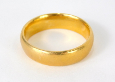 A 22ct gold wedding band, 6.4g, size L-M. - 2