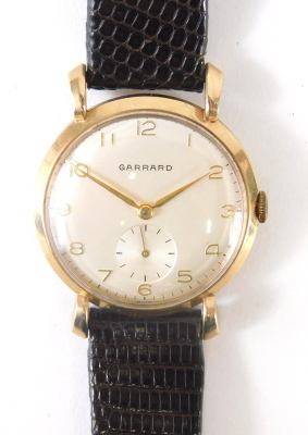 A mid 20thC gentleman's manual Garrard wristwatch, the 4cm diameter case with Arabic dial and baton subsidiary second hand and pointers, with a textured strap, original box and paperwork, engraved Ruston & Hornsby verso. - 4