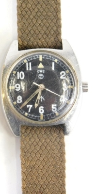 A 1970s CWC military issue wristwatch, with shaped case, luminous hands and markers, chrome case and textured material bracelet, marked 6BB-6645-99 523-8290 686/79 with crow's foot to the face and verso, 4cm wide. - 3